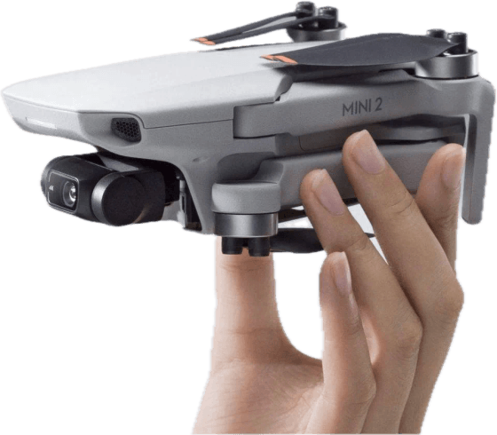 Un DJI Mini 2 sostenido con la mano